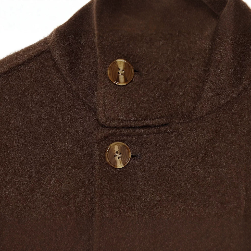Wearing a long sleeved woolen jacket with a belt for women